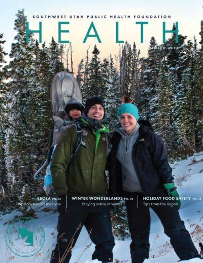 Front cover of "HEALTH" magazine, Winter 2015 issue, featuring a photograph of a smiling man and woman hiking together in a snowy pine forest.