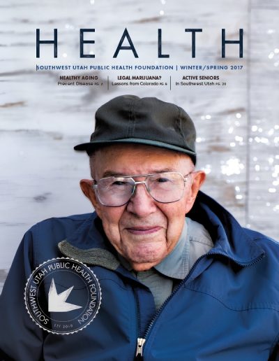 Front cover of "HEALTH" magazine by the Southwest Utah Public Health Foundation, Winter/Spring 2017 issue. The main photograph features a close-up portrait of an elderly man with glasses and a dark baseball cap, smiling warmly while wearing a blue jacket.